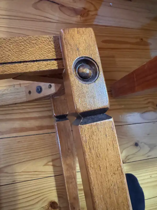 The legs of a table, the tabletop has been removed. There is routed inlaid detail on the legs.