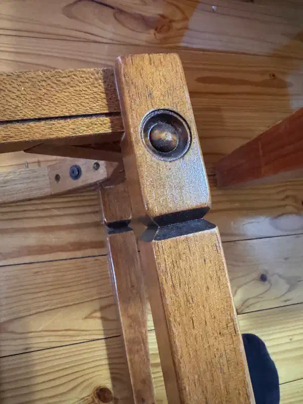 The legs of a table, the tabletop has been removed. There is routed inlaid detail on the legs.